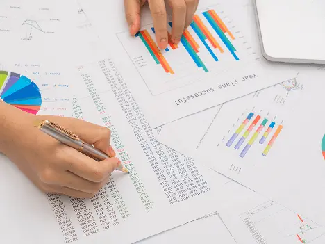 Student analyzing graphs and tables for data interpretation in ACT online coaching science section